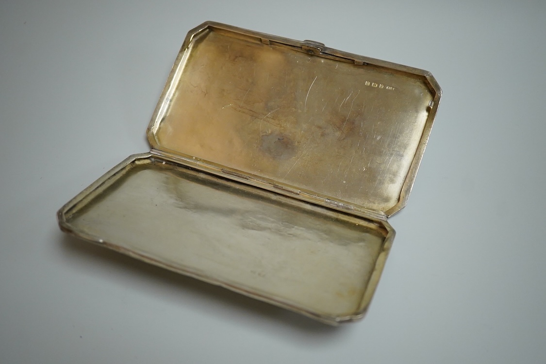 A George V silver rectangular cigarette case, with canted corners, Henry Matthews, Birmingham, 1926, 14.3cm, 6oz.